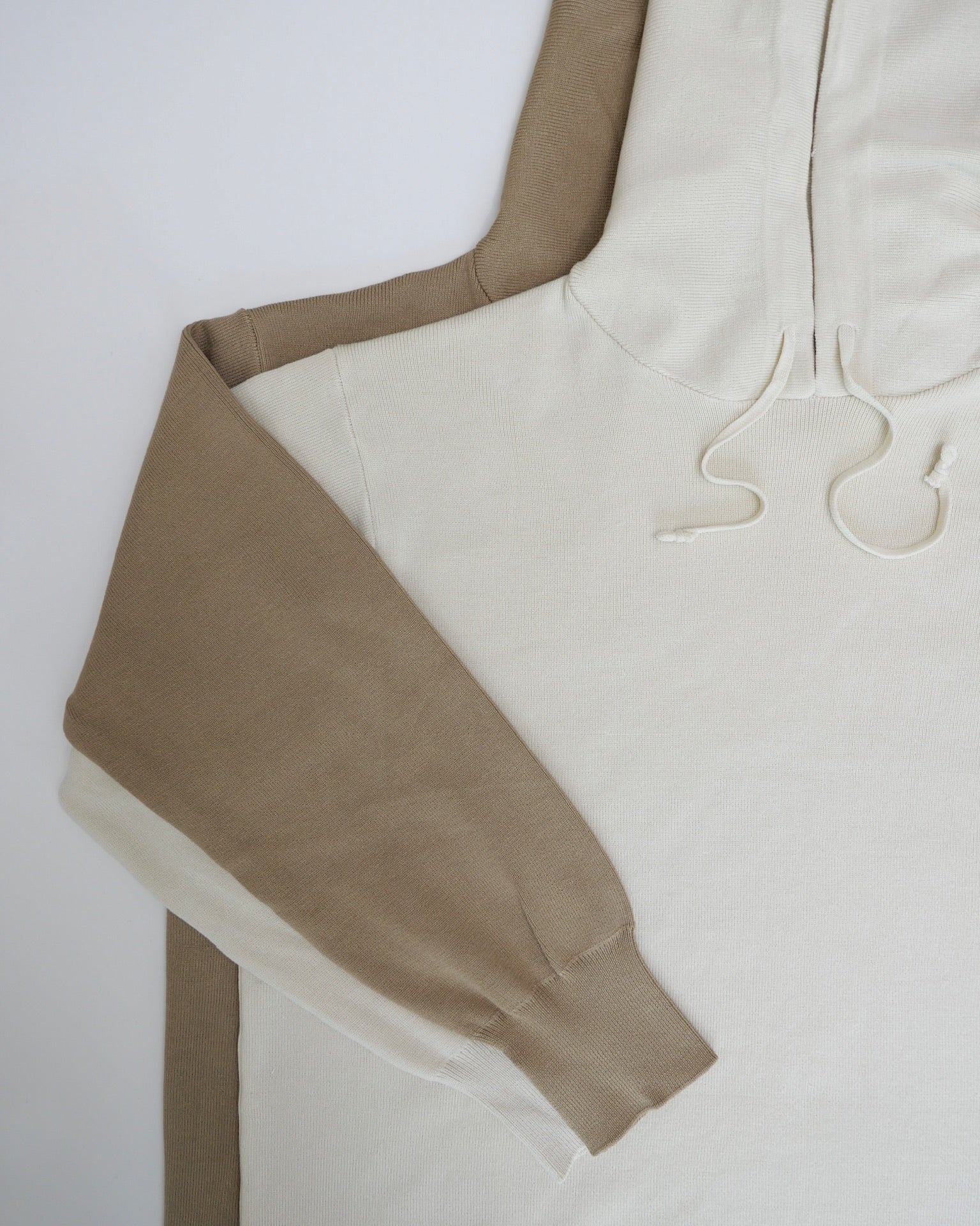 Close-up of a beige garment with a white background