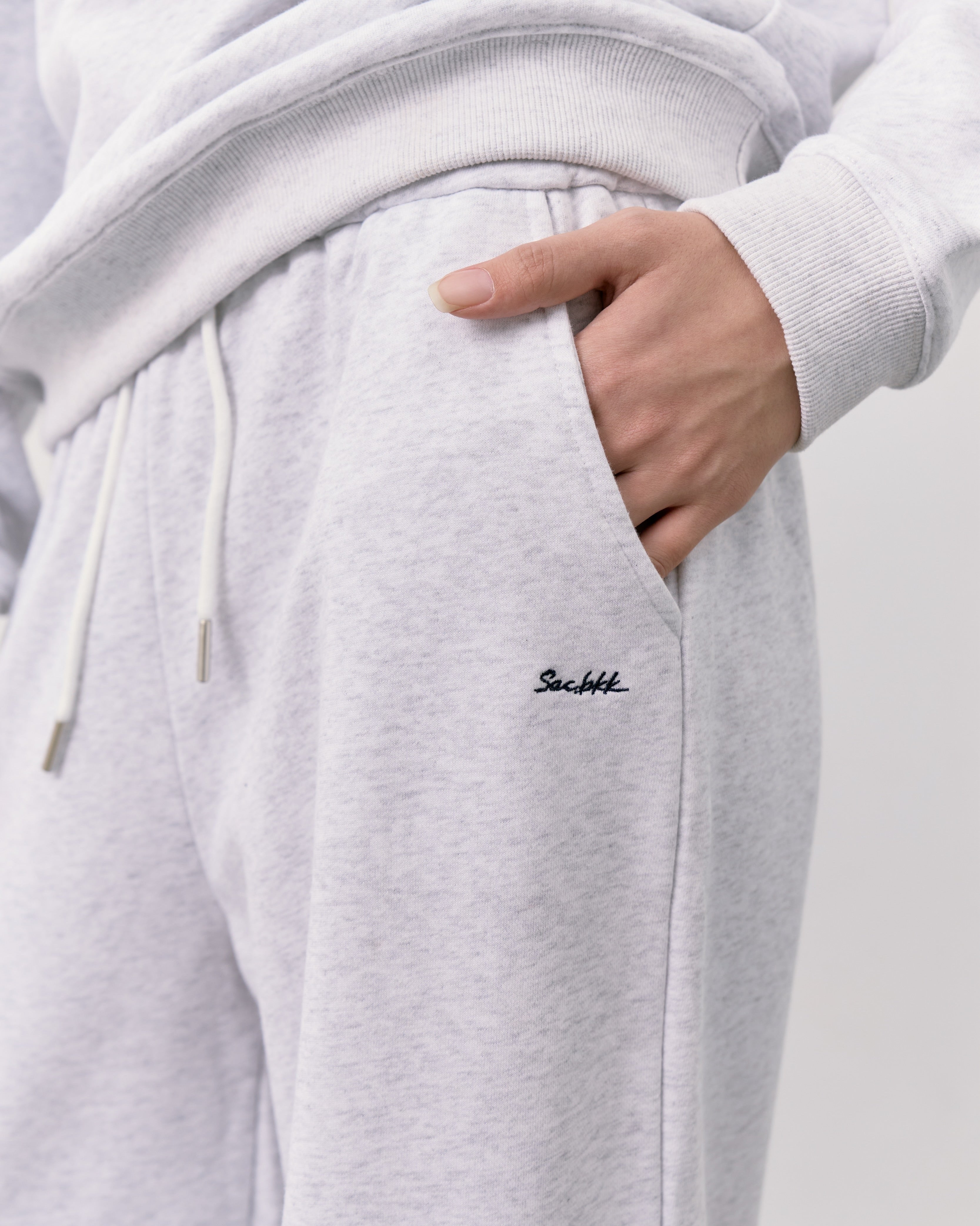 Gray sweatpants with a brand logo on a white background