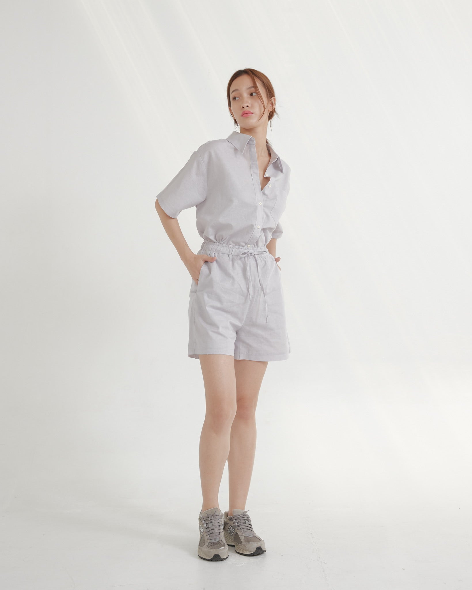 woman wearing a Taro outfit on a white background